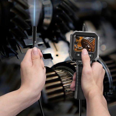 Handheld Endoscope Camera With 2.8 Inch IPS Display And Eight LEDs inspecting mechanical parts in close-up.