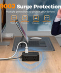 All-In-One Surge Protector Power Strip With 900J Surge Protection, 8 AC Outlets Plus USB C and USB A Ports, 5 Ft Flat Plug, 1250W Max, 11 Devices Charging Station, Black on desk