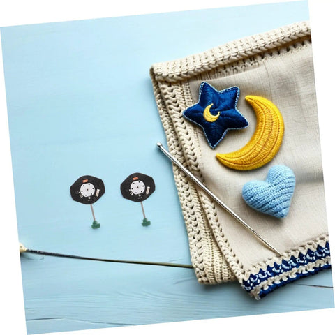 Two quartz watch movements with crochet stars and hearts, blanket, and knitting needle. Quartz Movement Replacement Kit 6 Pcs For DIY Watch Repair