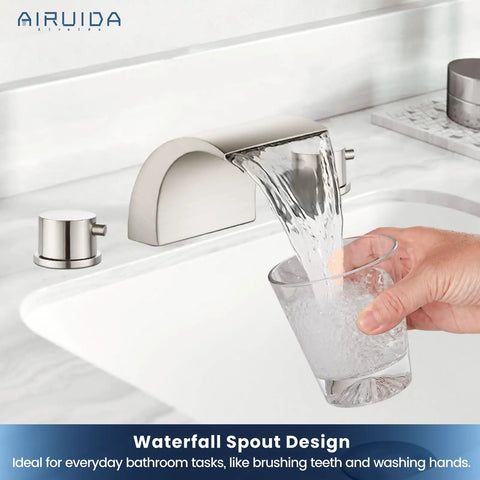 Person filling glass of water from waterfall spout of Roman tub faucet with 3 hole widespread mount and brushed nickel finish