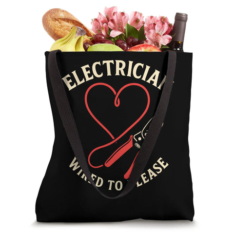 Black canvas shoulder bag filled with groceries, featuring 'Electrician Wired To Please' graphic design.