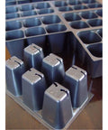 Close-up of plastic No Fuss Seedling Starter Trays Set With 720 Cells, 120 Trays, 1.5 Inch Square Cells With Drainage Holes