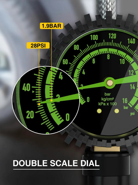 Heavy Duty Tire Pressure Gauge With Large Glow Dial And Steel Braided Hose Reaching Two Hundred Thirty Psi Via Quick Connect Coupler displaying 28PSI reading.
