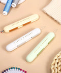 Lightweight ABS Needle Threader And Seam Ripper Tool 3 Piece Set In One Dual Head Design For Quick Threading Stitching And Hand Sewing Tasks Super Handy For Crochet And Craft Fans, three ABS tools on beige background