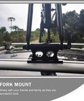 Quick Release Bike Roof Mount For Roof Racks Heavy Duty Iron Construction Stable Fork Carrier with a mounted bike visible