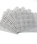 Stack of 24 Pack Drainage Floor Mats With Interlocking Cushions, Non Slip PVC Mats, 30x30cm Grey, showing perforated design.