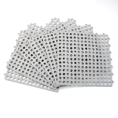 Stack of 24 Pack Drainage Floor Mats With Interlocking Cushions, Non Slip PVC Mats, 30x30cm Grey, showing perforated design.