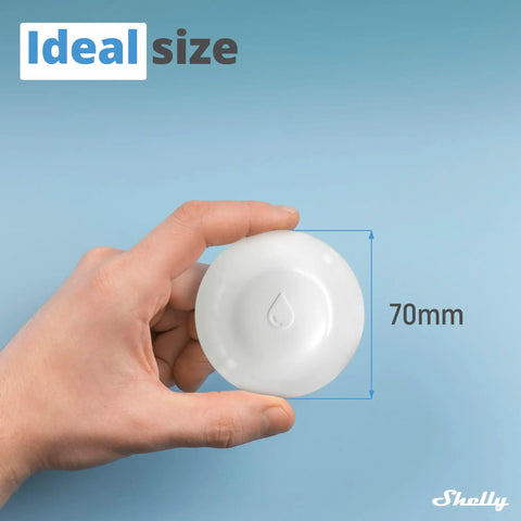 Hand holding compact white wireless flood sensor with temperature measurement for home automation, 70mm size, easy to use