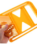 Badass Grip Featherboard Safety Clamp For Circular And Band Saws held in hand showcasing sturdy yellow design for securing wood.