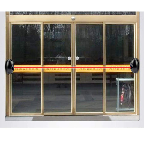 Rock Solid Infrared Through Beam Sensor With Alarm Transmitter for garage doors and sliding gates installed on glass entrance.