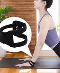 Woman stretching in yoga pose wearing Breathable Wrist Straps For Sports And Everyday Relief High Support Wraps with zoned pressure.