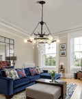 Living room with Wagon Wheel Chandelier 9 Light Black Farmhouse Industrial Metal Pendant Light With Crystal Accents