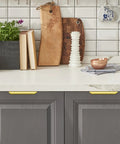 Gold Finger Edge Pulls For Cabinets 10 Pack 150mm Length With 128mm Center To Center 5 Hole Design installed on gray kitchen drawers