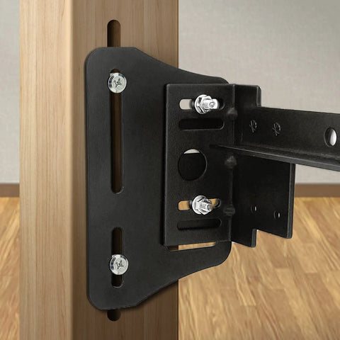 Close-up of Premium Universal Bed Frame Brackets And Headboard Connectors Black 2 Piece Steel Plates mounted on wood post.