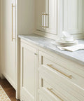 Installed Champagne Bronze Cabinet Pull 12-5/8 Inch Center To Center Bar Handle on white kitchen cabinets and drawers