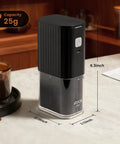 Road Trip Ready Portable Electric Coffee Grinder With Adjustable Stainless Steel Burrs, USB Rechargeable One Touch Auto Stop, No Sweat Brewing For Espresso To French Press, Collapsible Hopper In Black on a table with coffee.
