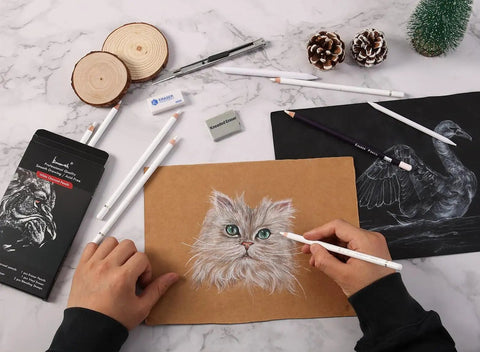 Hands using the White Charcoal Pencils Set 12 Piece For Dark Paper Drawing And Sketching, drawing a cat on brown paper.