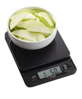 Glass Top Food Scale With Touch Controls 11 lb Capacity Sleek Black Kitchen Scale For Chef Grade Precision Weighing In Grams And Ounces Easy To Use Power On Modern Design And Fast Readouts with bowl of sliced apples