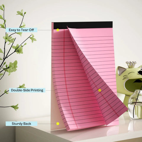 Pink 5x8 inch college-ruled legal pad with micro perforation, easy to tear off, showcased on desk with plant decor.