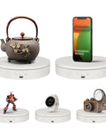 Foxvee 7.87 Inch White Motorized Rotating Display Stand 360 Silent Spinning Turntable showcasing a teapot, phone, figure, watch, and camera.
