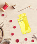 Automatic Needle Threader Tool Set With 12 Pieces Dope Durable PP Material Precise Threading For Fine Needles Versatile Thread Compatibility Lightweight Home Sewing Aid For Seniors And DIY Projects, yellow PP tool on sewing desk