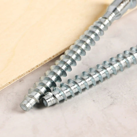 M7x70mm Hex Socket Countersunk Self Tapping Furniture Screws close-up on marble surface, flat head, carbon steel, zinc plated
