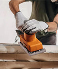 Person using Heavy Duty Mesh Sanding Sheets For Wood Drywall And Metal on a power sander, smoothing surface effectively.