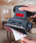 Get This Awesome 20 pc Set of Heavy Duty 115mm Square Sanding Sheets With Eight Holes For Smoothing Wood And Metal Like A Boss attached to a sander.