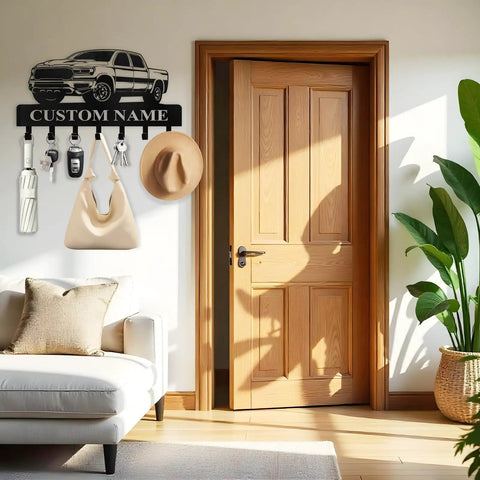 Dope Personalized Key Holder Wall Mount With Custom Name, heavy-duty metal with hooks, mounted in living room next to door.