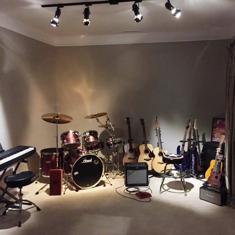 Music studio with drum set, guitars, and Two Pack Dope Industrial Vintage Ceiling Track Lights With Adjustable Spotlight Heads.
