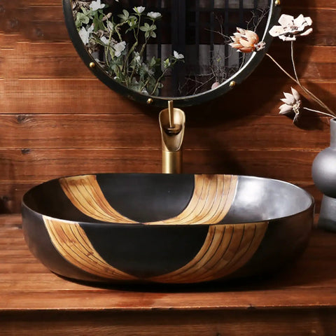 SDVantage Ceramic Bathroom Vessel Sink, Artistic Carved Countertop Basin Sink Black 59 * 40 * 15Cm on wooden surface.