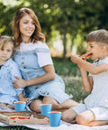 Family picnic with blue sturdy 5oz disposable paper cups, 1200 pack ideal for cold drinks, parties, events, and snacks outdoors.