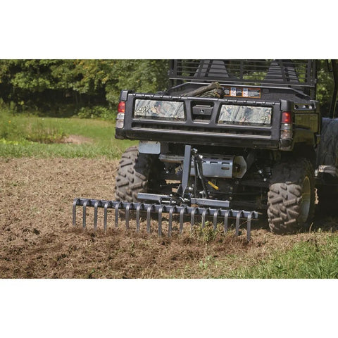 Landscape Rake Attachment For ATV Or UTV, 60 inch wide with 17 tines, leveling soil in a large grassy area
