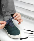 Upgrade Your Kicks With This Ultimate 78-Piece Shoe Lace End Cap Repair Kit. Kid tying sneaker lace with heat shrink tips