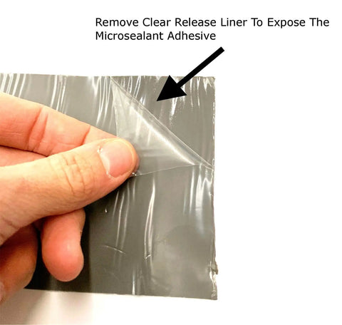Close-up of hand peeling liner on 4 Inch By 10 Foot RV Roof Sealant Tape That Permanently Stops Leaks, Waterproof And UV Weatherproof Sealant