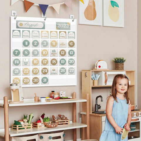 Child in classroom with Durable Nylon Classroom Calendar Pocket Chart for 2.75 by 2.75 cards, 24-inch hanging on wall.
