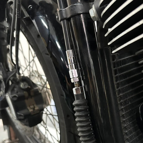 Slick Cnc Aluminum Motorcycle Clutch Cable Adjuster Upgrade For Harley Softail Fat Boy Street Bob Low Rider Touring 2018 To 2024 close-up of cable adjuster mounted on bike frame.