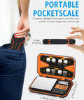 Person placing pocket digital scale with high precision 500g capacity and 0.01g increments LCD display in back pocket.