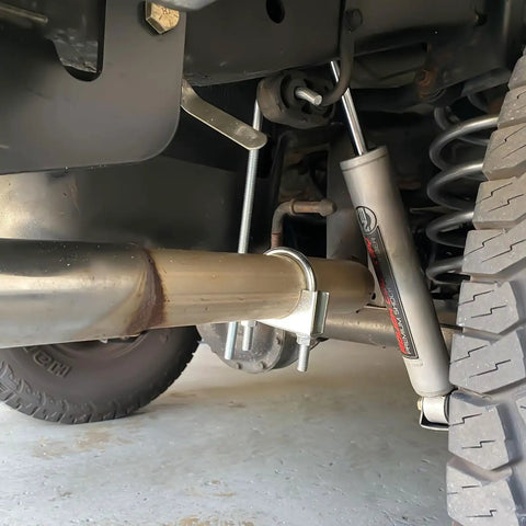 Undercar view showing Two Point Five Inch Exhaust Hangers And Muffler Hangers Two Pack, 304 Stainless Steel Vibration Dampening Hooks.