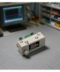 CNC DC Step Up Step Down Converter With Color Screen Adjustable Voltage And Current Regulator Power Supply on lab table