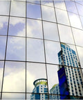 Reflection in glass showing cityscape with Dope Dark Silver Window Film For Daytime Privacy And Heat Reduction Very Dark Reflective Mirror Tint