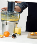 Person using juicer with Stainless Steel Juicer Drive Coupling Replacement Part Easy Install Durable Juicer Coupler For Most Juicers