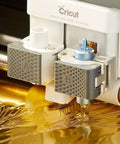 Close-up of Cricut foil transfer kit components on white Cricut machine; A and B tool housings with interchangeable tips