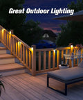 Solar Fence Post Lights 6 Pack, Waterproof Outdoor LED Fence Lighting For Backyard illuminating a wooden staircase and deck