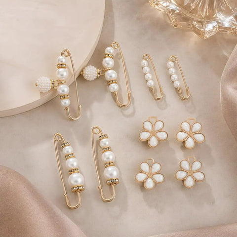 8 Piece Pearl Waist Tightener Pins For Loose Jeans And Pants Belt Alternative Clip in gold with pearl design on a soft surface.