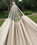 Close-up of Handmade Cotton Woven Hammock Chair With Rope Swing And Crochet Fringe For Indoor Outdoor Patio Backyard Garden Boho Vibes Natural White