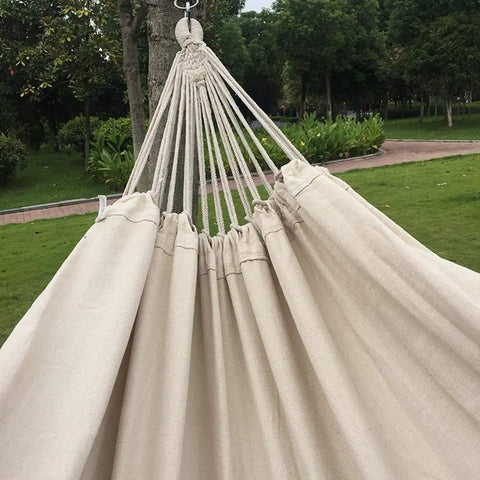 Close-up of Handmade Cotton Woven Hammock Chair With Rope Swing And Crochet Fringe For Indoor Outdoor Patio Backyard Garden Boho Vibes Natural White