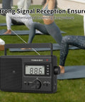 Go-To Portable AM FM SW Radio With AC DC Power ATS Auto Scan LCD Clock Display USB And SD Card MP3 Player in outdoor setting