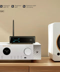 XLR Bluetooth Receiver V5.1 with LDAC and aptX HD next to audio equipment and speaker on wooden shelf.