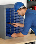 Worker using 40 Drawer Bolt Bin Organizer Cabinet With Metal Body And ABS Drawers For Nuts Bolts Screws And Small Hardware